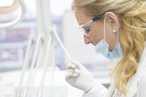 surgeon looking at a patient